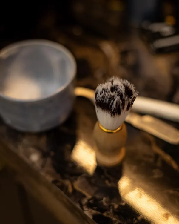 Shaving brush and bowl on the counter